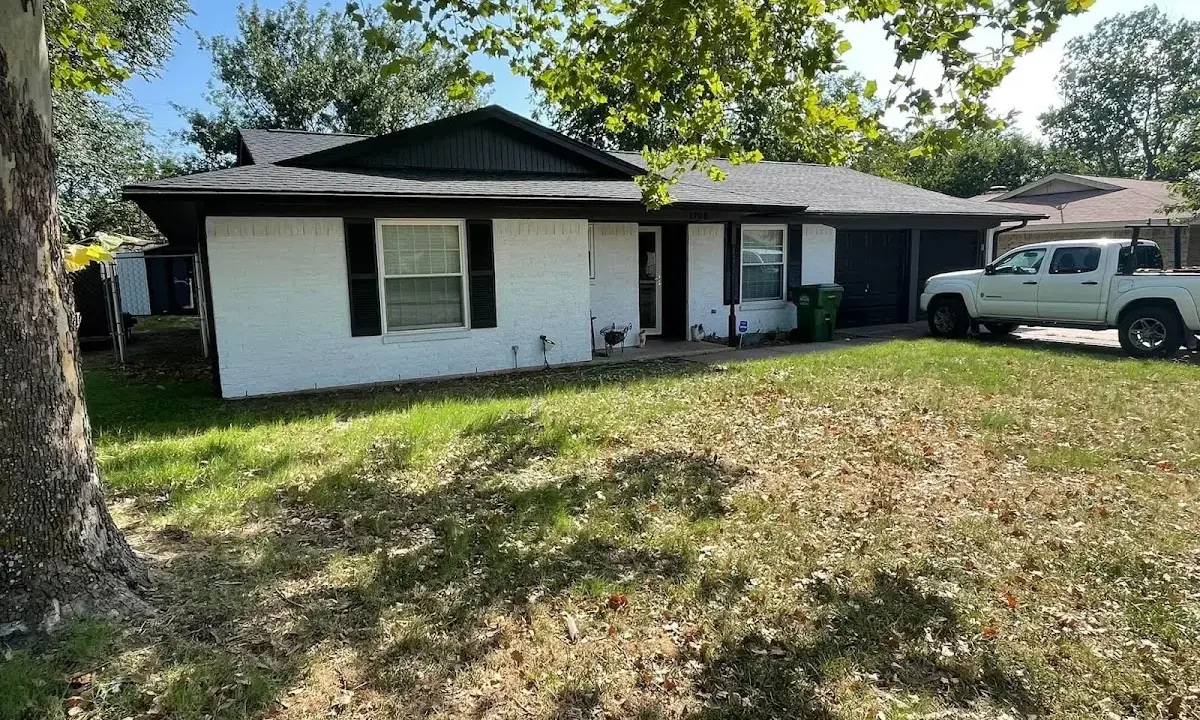 Professional roofing crew working on a residential roof in Trotwood